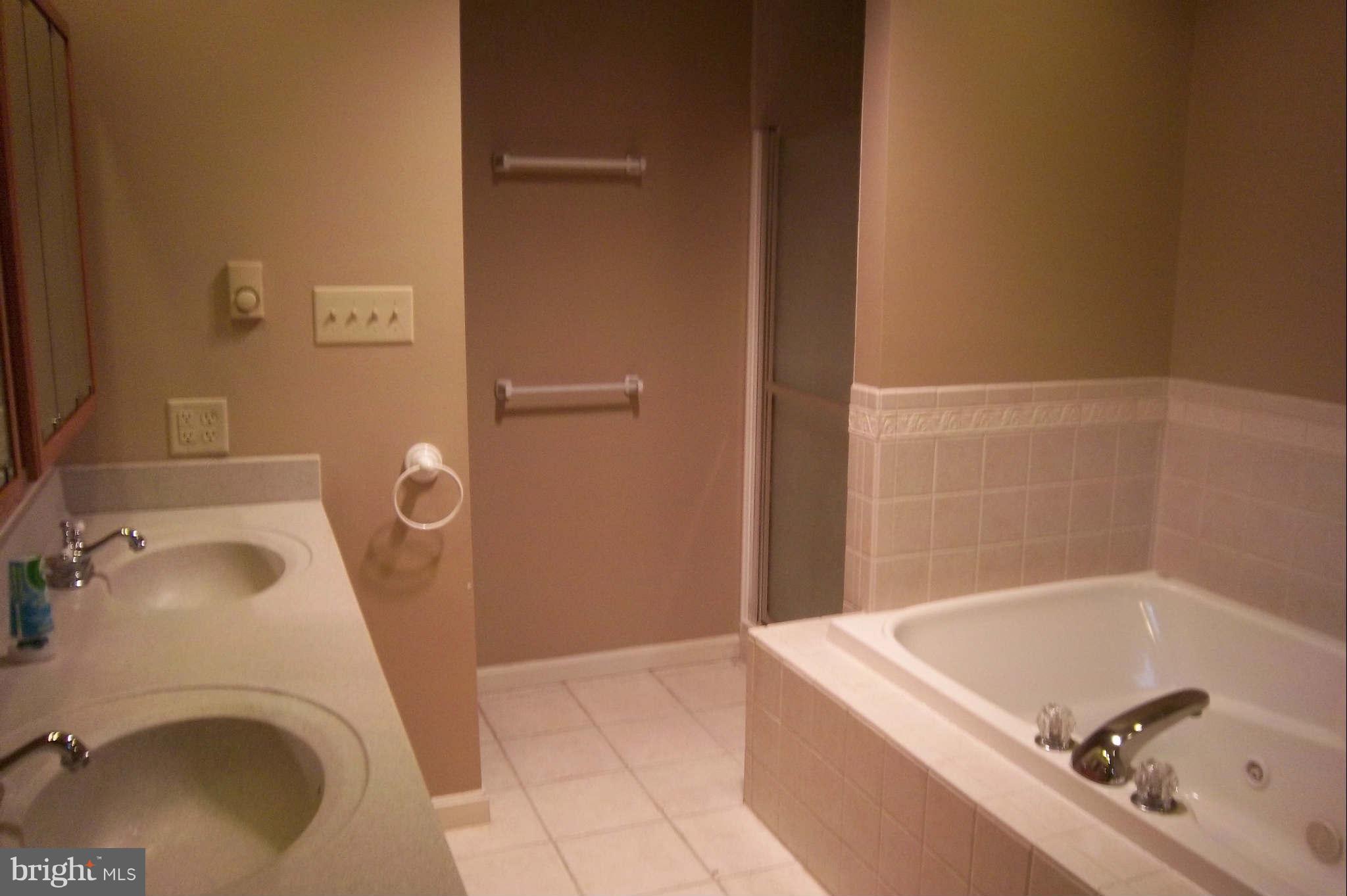 7749 Talhelm Road Chambersburg, PA 17202 - Photo 14 of 26 a bathroom with a tub sink and toilet