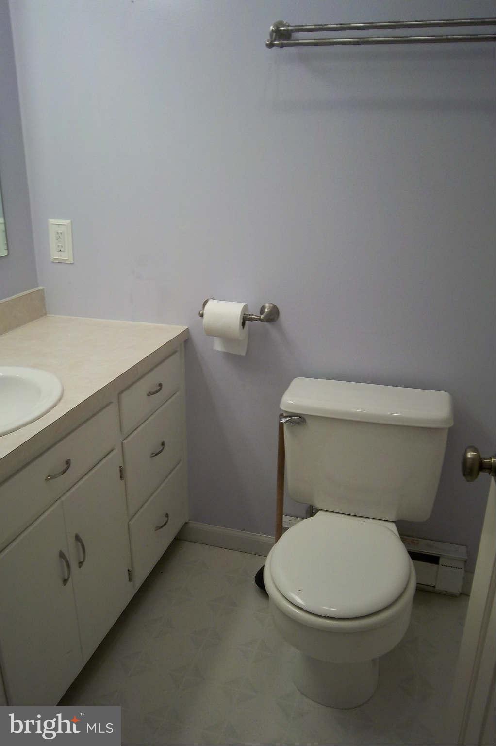 7749 Talhelm Road Chambersburg, PA 17202 - Photo 10 of 26 a white toilet sitting next to a bathroom sink