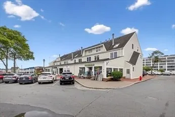 a view of multiple houses with a street