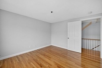 86 Wharf Street, Unit L6 Salem, MA 01970 - Photo 14 of 30 a view of an empty room with wooden floor and a window