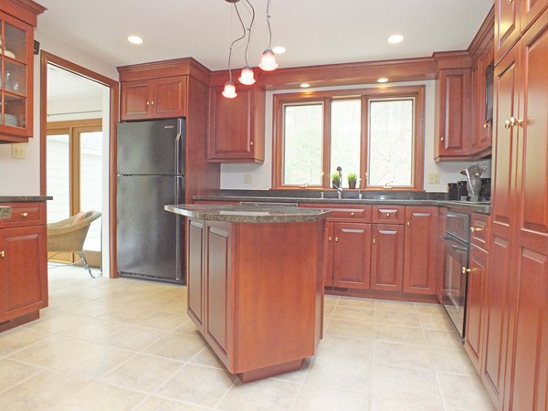 9 Rack Road Chelmsford, MA 01824 - Photo 8 of 30 a kitchen with stainless steel appliances granite countertop a refrigerator a sink a stove and a microwave oven