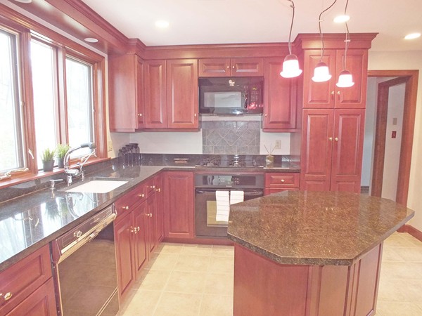 9 Rack Road Chelmsford, MA 01824 - Photo 9 of 30 a kitchen with cabinets a sink and a large window