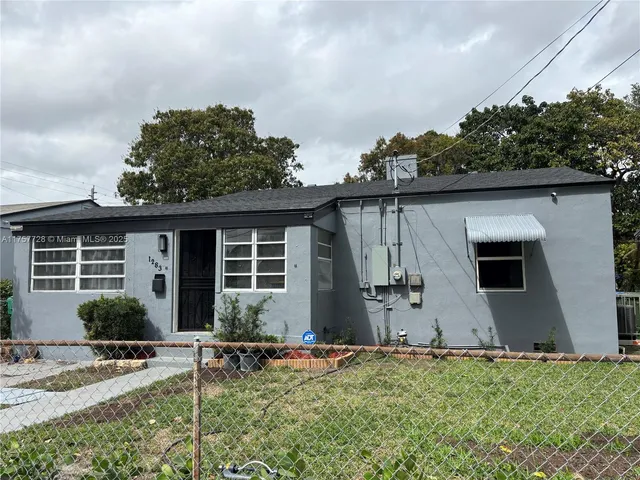 a backyard of a house with seating space