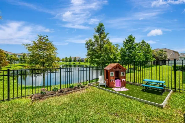 a view of a garden with a lake view
