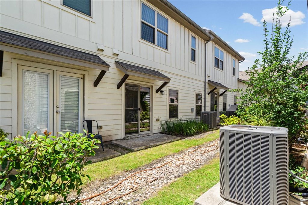1502 Airedale Road, Unit 2502 Austin, TX 78748 - Photo 15 of 28 A private outdoor space with verdant landscaping adjoins this charming row of residences.