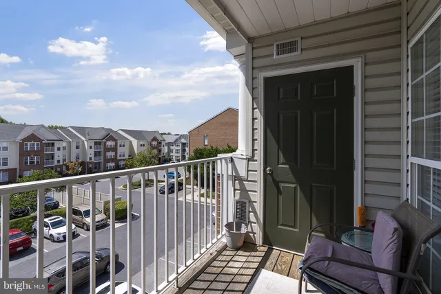 a view of a balcony with furniture