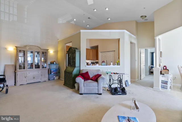 a bedroom with furniture and a large mirror