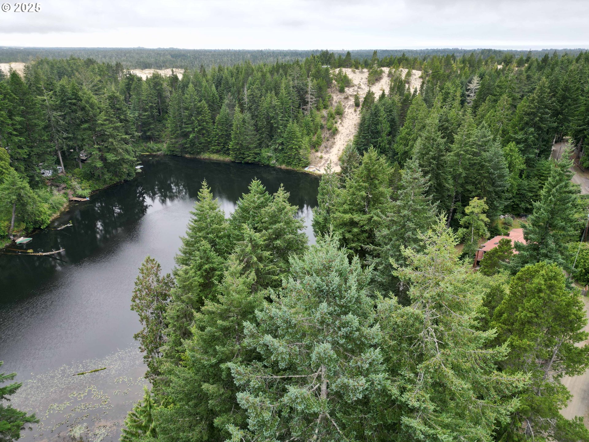 Collard Loop Florence, OR 97439 - Photo 8 of 17 a view of a lake with a city