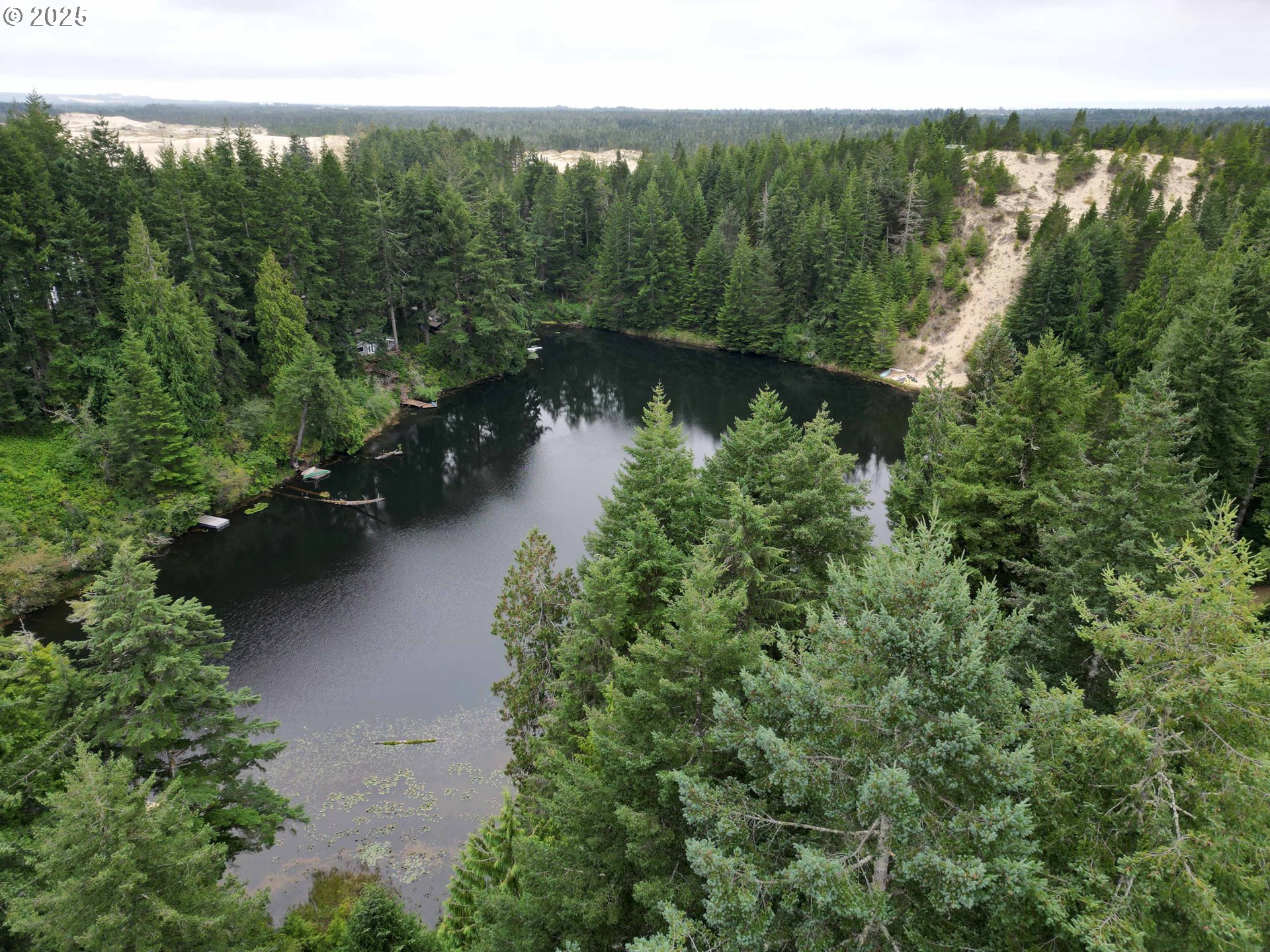 Collard Loop Florence, OR 97439 - Photo 9 of 17 an aerial view of a house with a yard