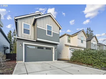 a front view of a house with a garage