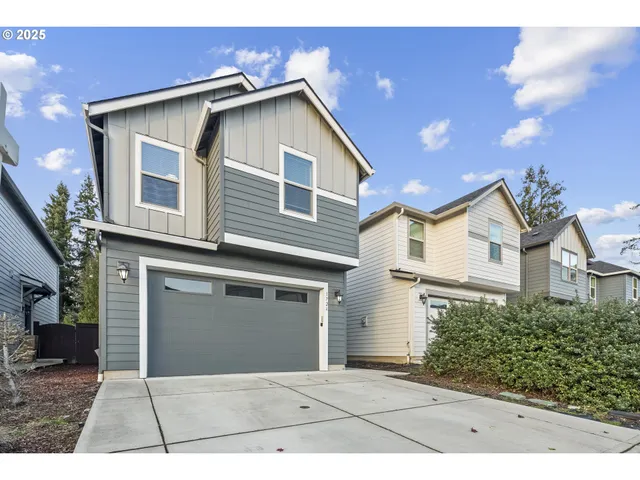 a front view of a house with a garage