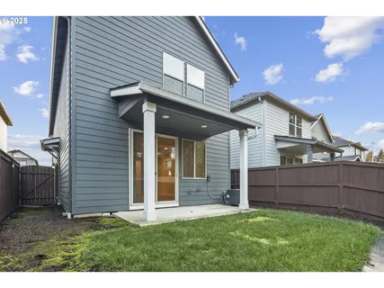 a view of a house with a backyard