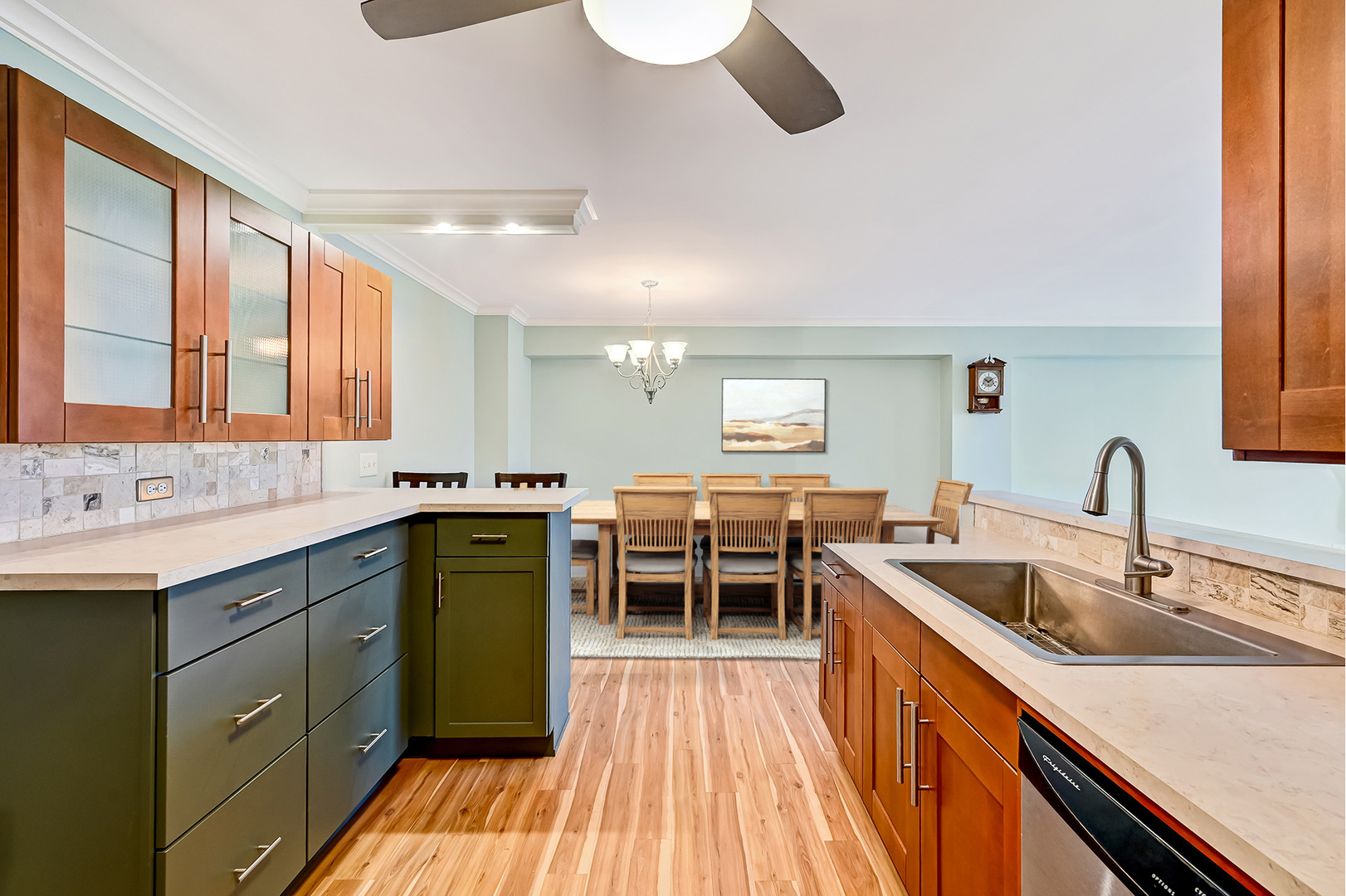 2211 South Highland Avenue, Unit 3E Lombard, IL 60148 - Photo 12 of 25 a kitchen with a sink and wooden cabinets