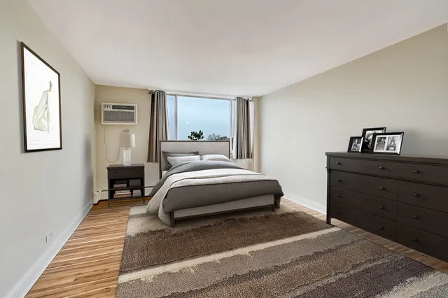 a bedroom with a bed and a dresser