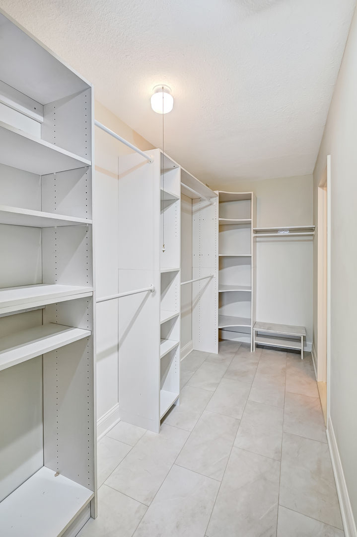 2211 South Highland Avenue, Unit 3E Lombard, IL 60148 - Photo 20 of 25 a view of walk in closet with empty racks