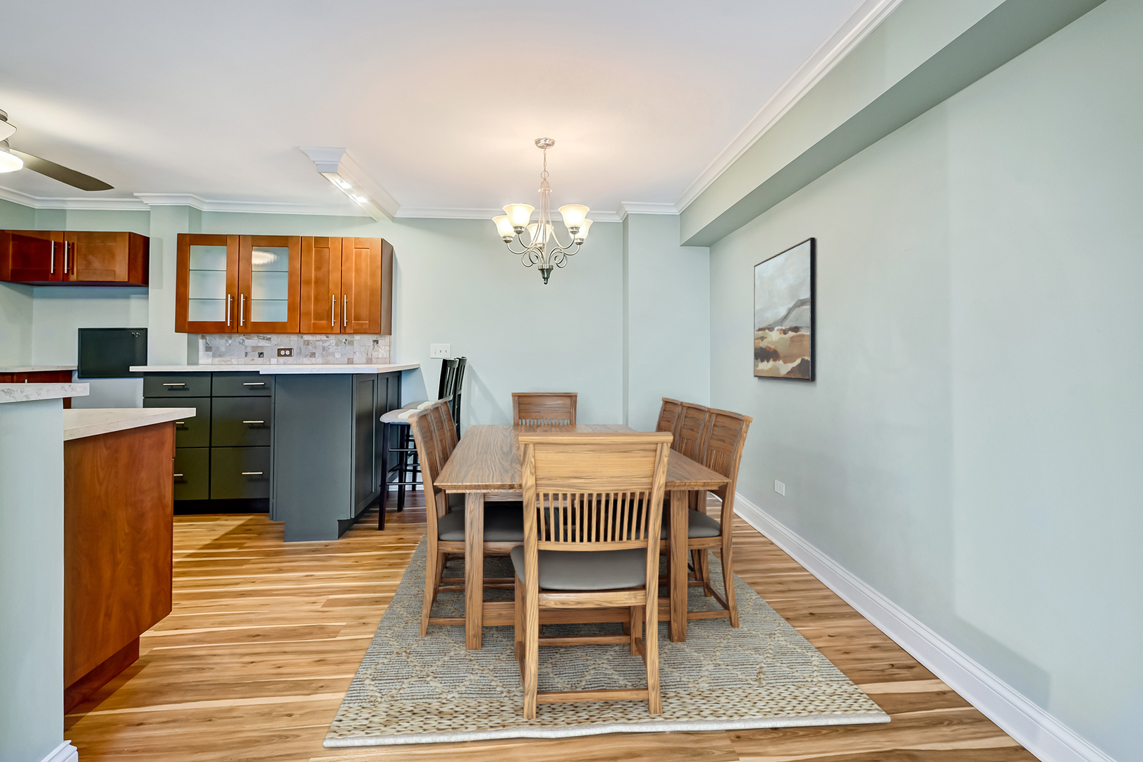 2211 South Highland Avenue, Unit 3E Lombard, IL 60148 - Photo 9 of 25 a dining room with a table chairs and a kitchen view
