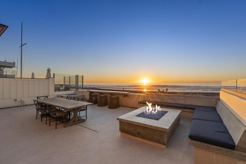 2016 Ocean Front Del Mar, CA 92014 - Photo 11 of 12 a terrace with outdoor seating and city view