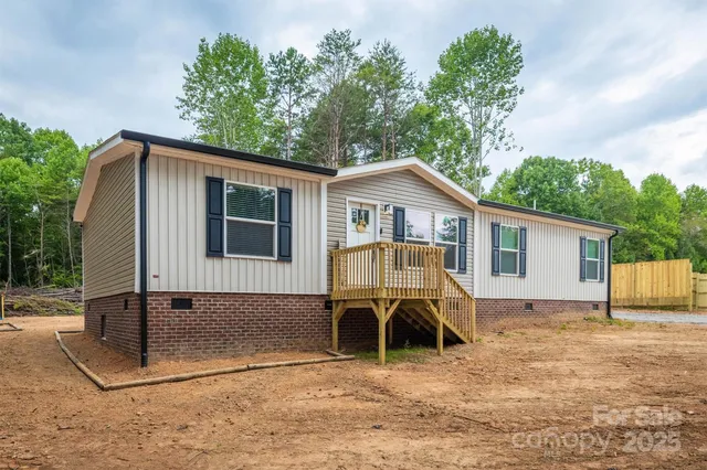 a front view of a house with yard porch and furniture