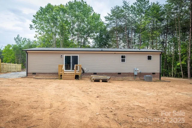 a backyard of a house with yard and garage