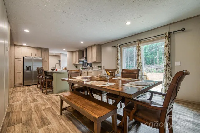 a view of a dining room with furniture window and outside view