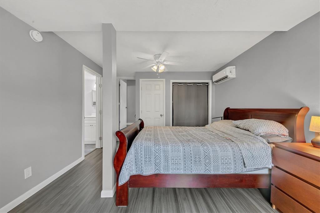 2305 Novus Street Sarasota, FL 34237 - Photo 11 of 28 a bedroom with a bed and a painting on the wall