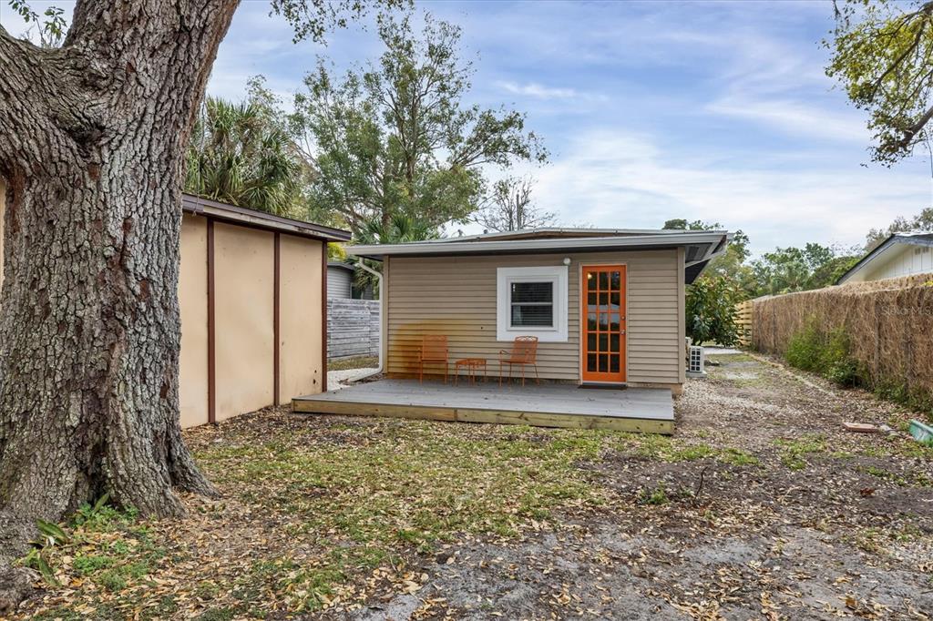 2305 Novus Street Sarasota, FL 34237 - Photo 23 of 28 a backyard of a house with wooden floor and fence