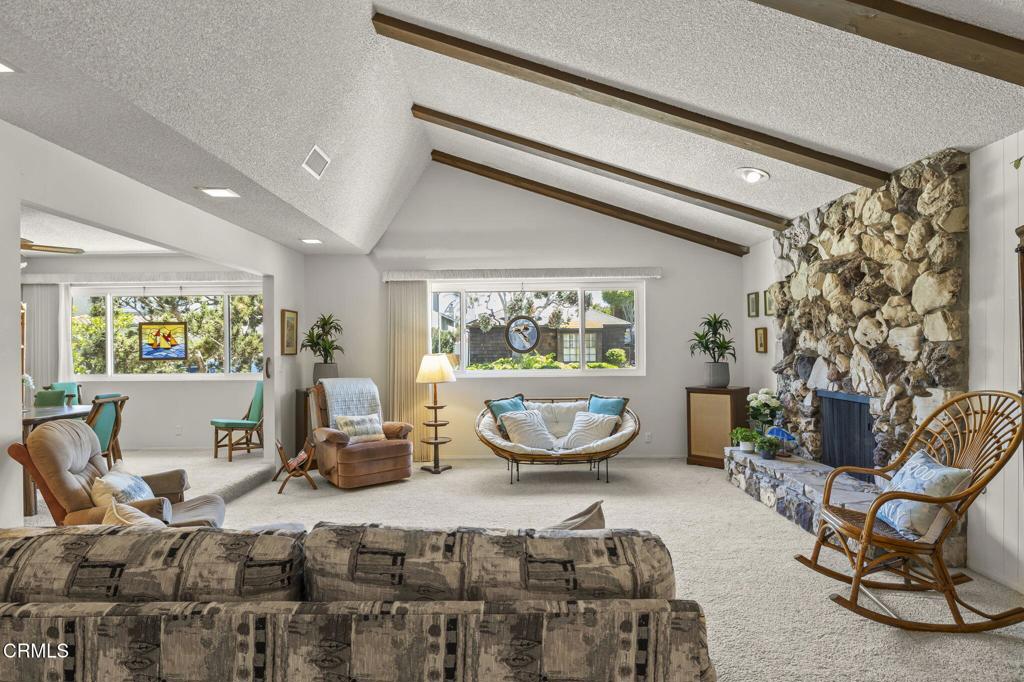 4907 Island View Street Oxnard, CA 93035 - Photo 12 of 44 a living room with furniture and a large window
