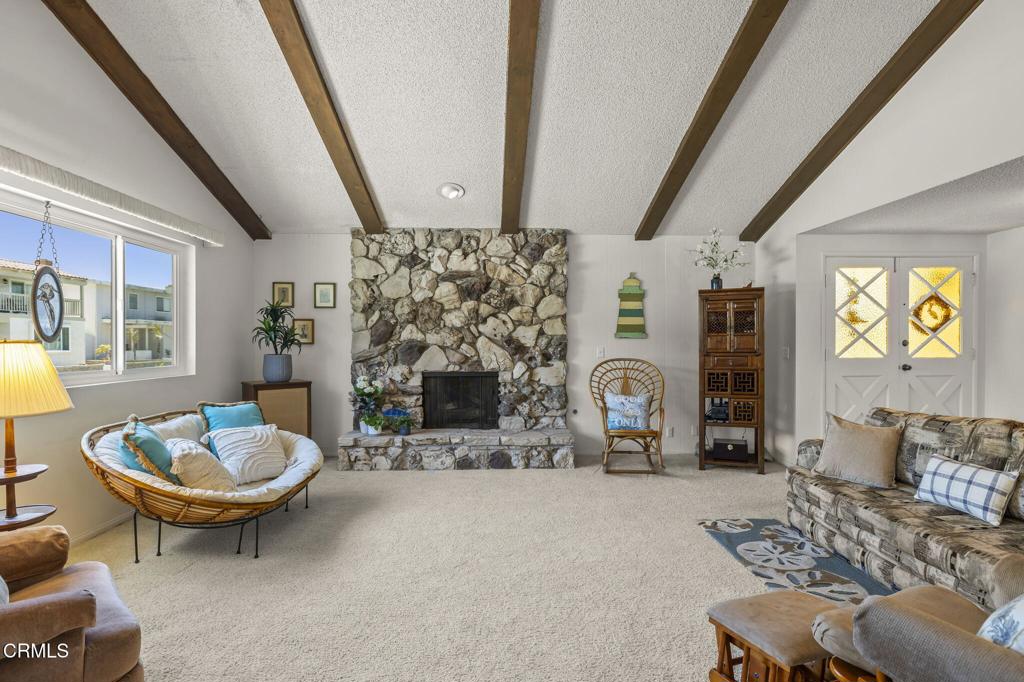4907 Island View Street Oxnard, CA 93035 - Photo 2 of 44 a living room with furniture and a fireplace