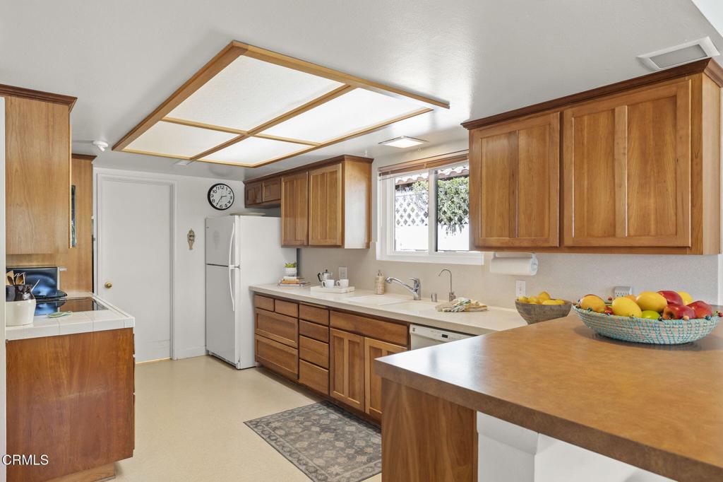4907 Island View Street Oxnard, CA 93035 - Photo 23 of 44 a kitchen that has a sink and a stove in it