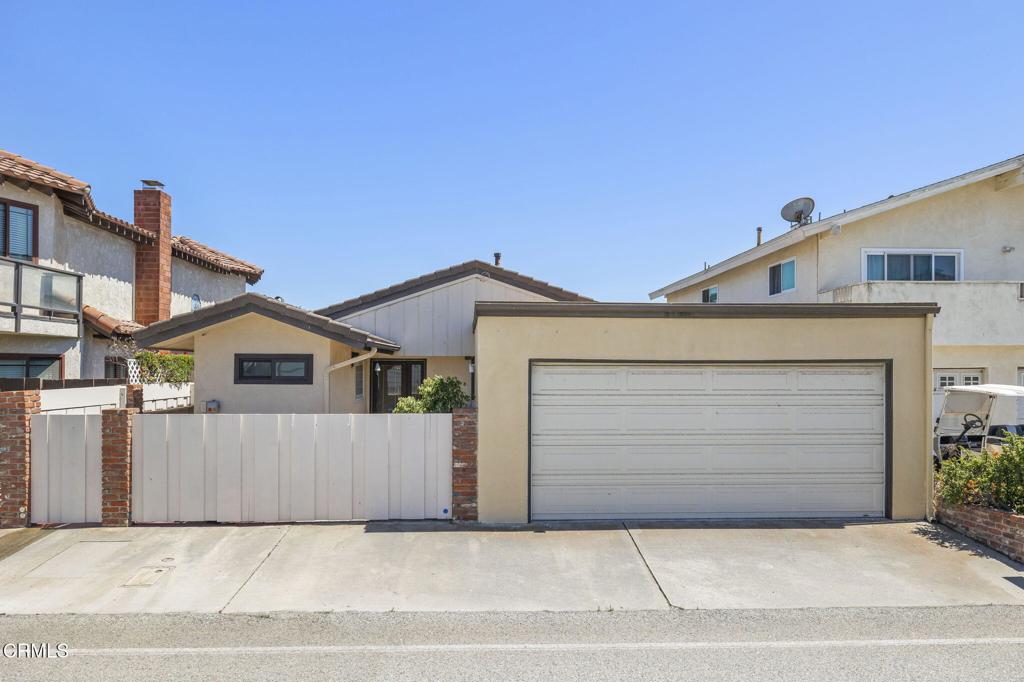 4907 Island View Street Oxnard, CA 93035 - Photo 40 of 44 a front view of a house with a garage