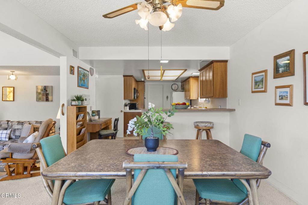 4907 Island View Street Oxnard, CA 93035 - Photo 4 of 44 a view of a dining room with furniture a chandelier and wooden floor