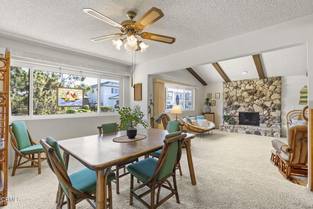 4907 Island View Street Oxnard, CA 93035 - Photo 5 of 44 a view of a dining room with furniture and a chandelier