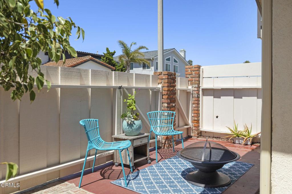 4907 Island View Street Oxnard, CA 93035 - Photo 7 of 44 a living room with furniture a window and a potted plant
