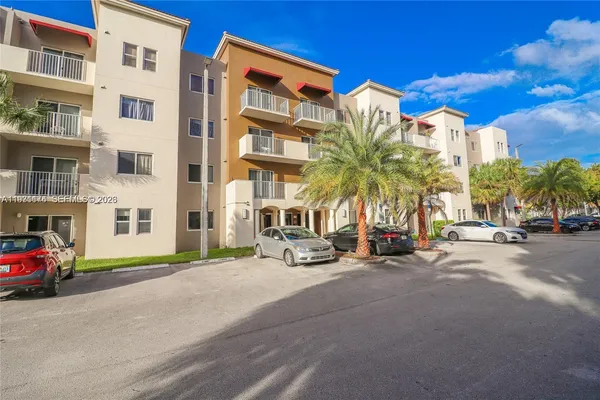 a view of a street with a building in the background
