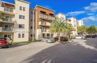 a view of a street with a building in the background