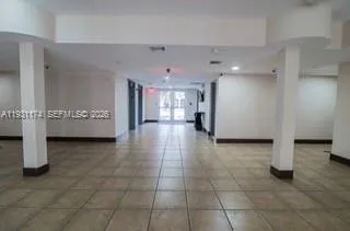 a view of a hallway with a living room