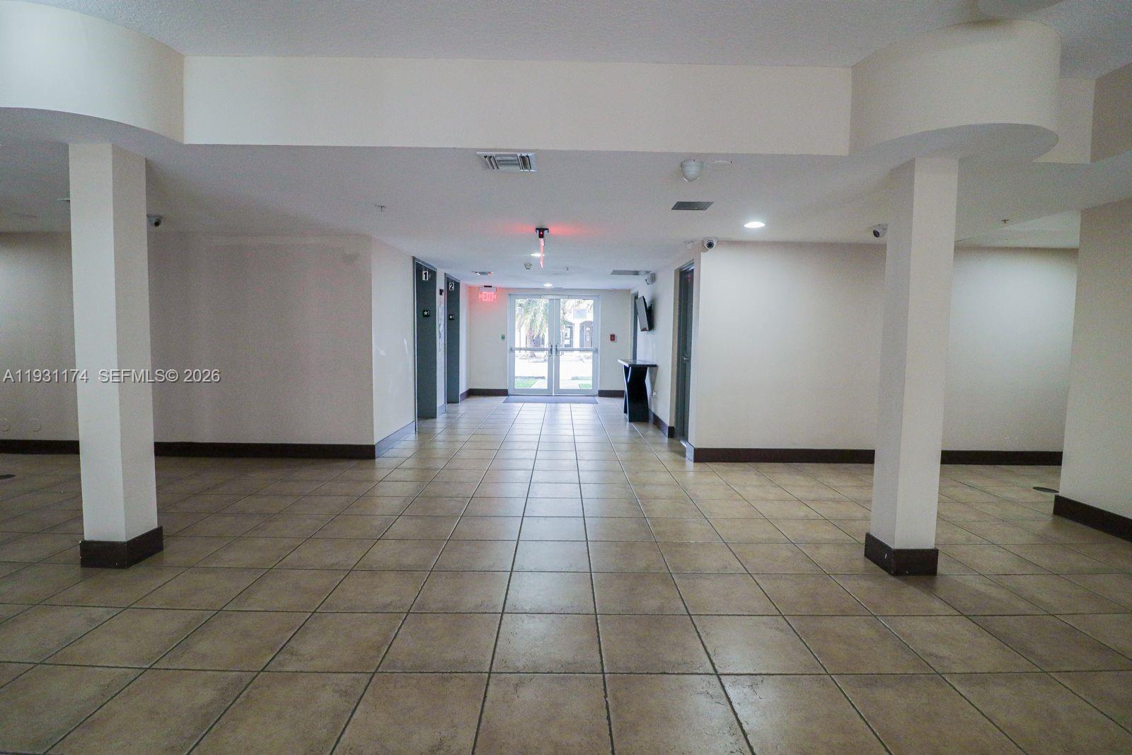 11050 Southwest 196th Street, Unit 305 Cutler Bay, FL 33157 - Photo 15 of 21 a view of a hallway with a furniture