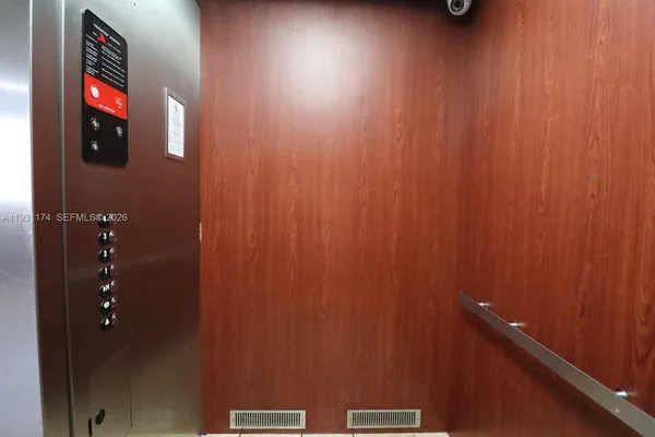 a bathroom with a shower and a mirror