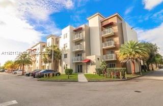 11050 Southwest 196th Street, Unit 305 Cutler Bay, FL 33157 - Photo 19 of 22 front view of a building with a street