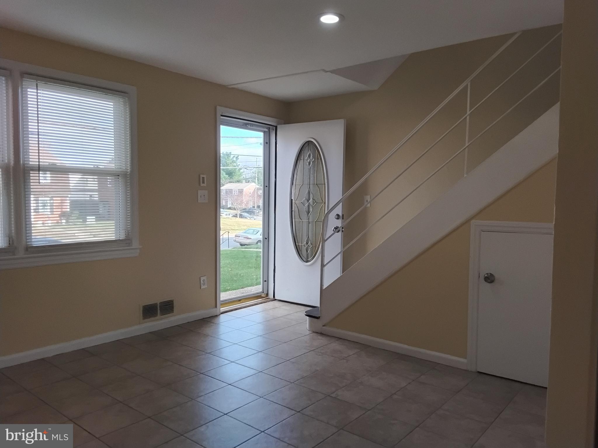 3867 26th Avenue Temple Hills, MD 20748 - Photo 2 of 27 a view of a livingroom with a staircase