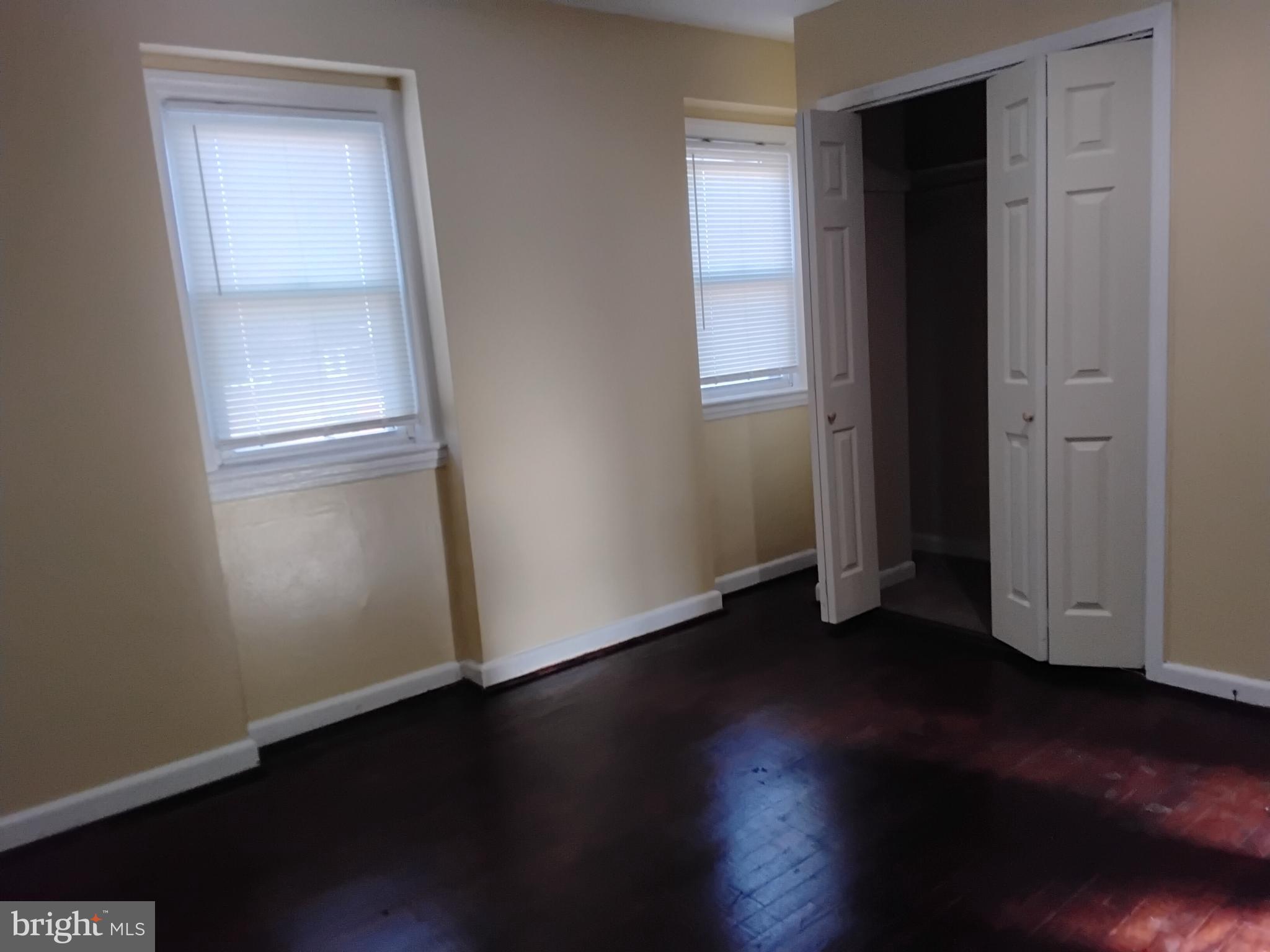 3867 26th Avenue Temple Hills, MD 20748 - Photo 22 of 27 an empty room with wooden floor and closet
