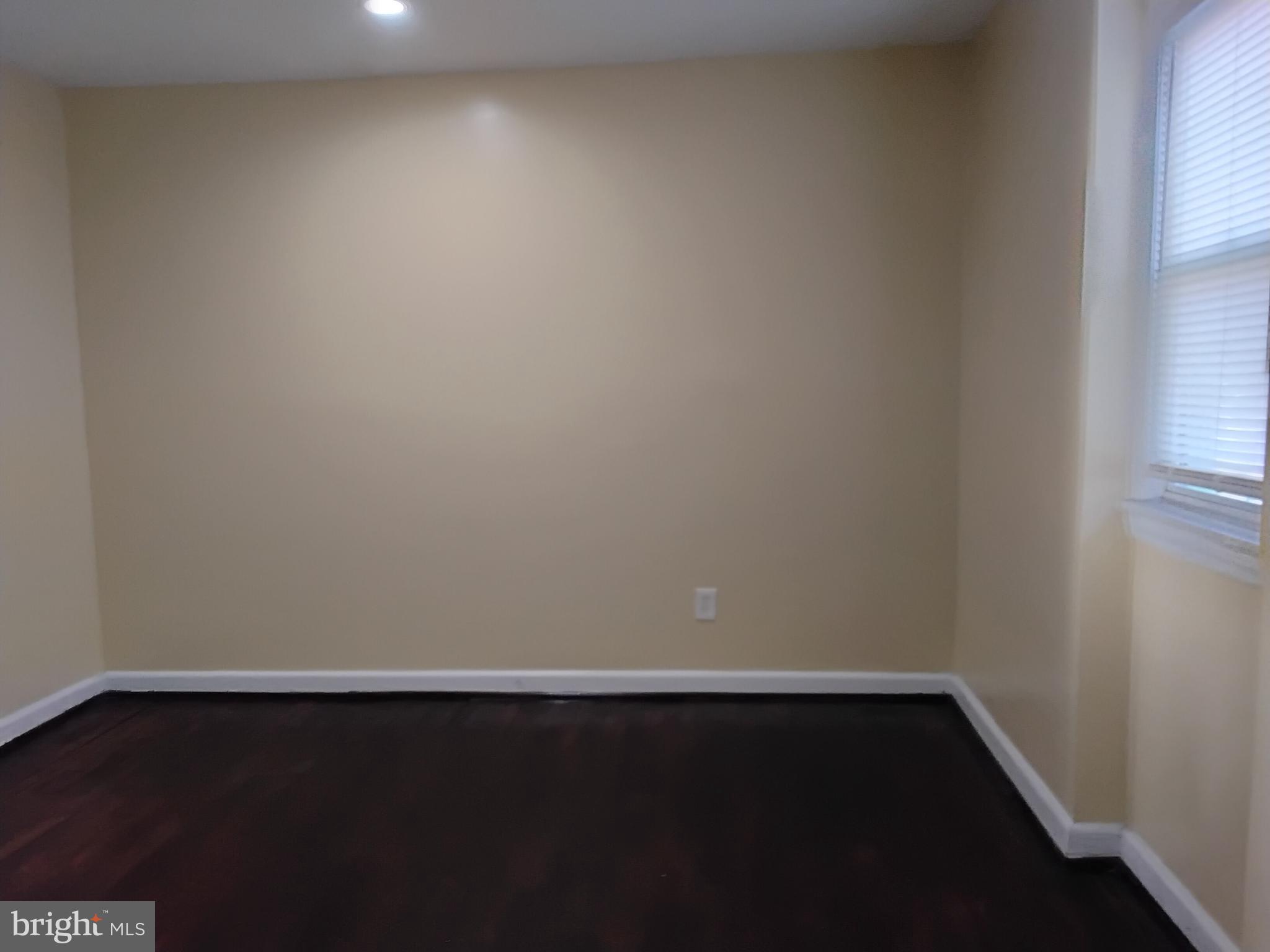 3867 26th Avenue Temple Hills, MD 20748 - Photo 23 of 27 a view of an empty room and wooden floor