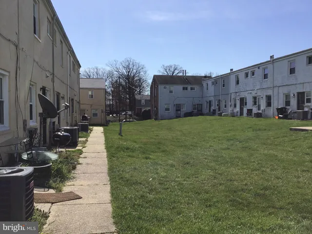 a view of a car parked in front of a house