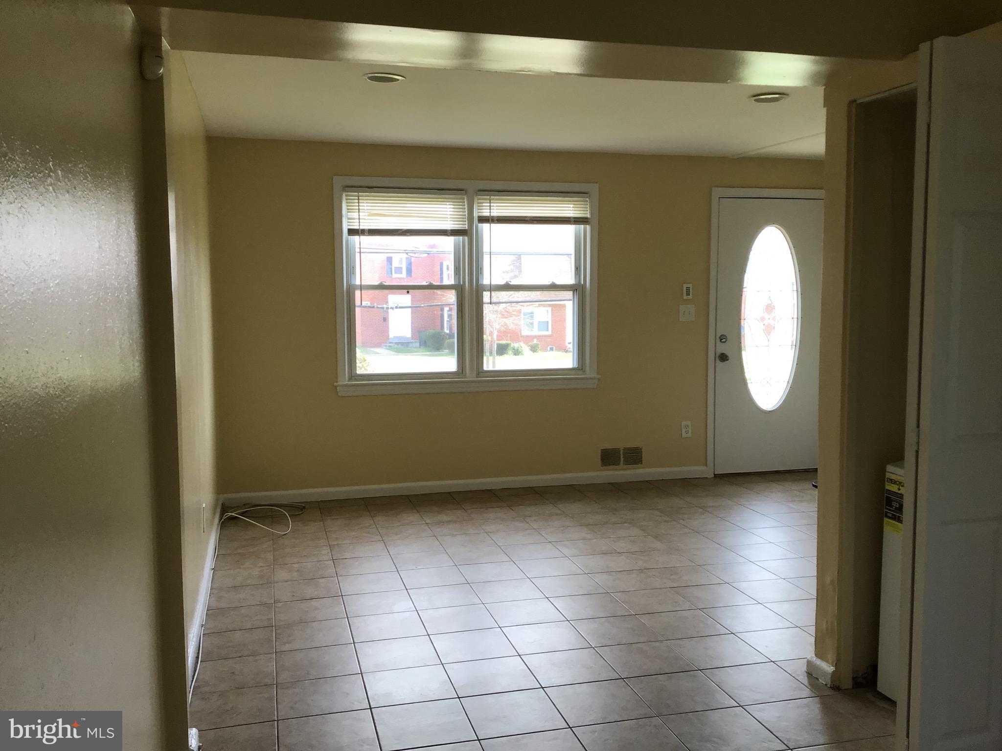 3867 26th Avenue Temple Hills, MD 20748 - Photo 3 of 27 a view of an empty room with a window