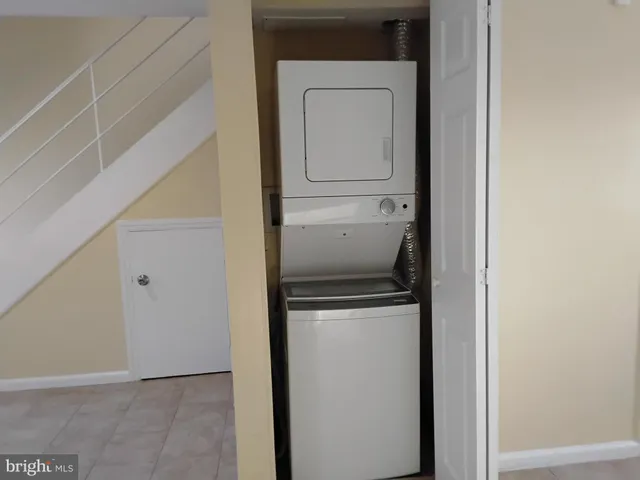 a kitchen with granite countertop cabinets and a stove top oven