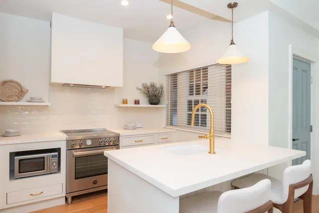 a view of kitchen with sink and wooden floor