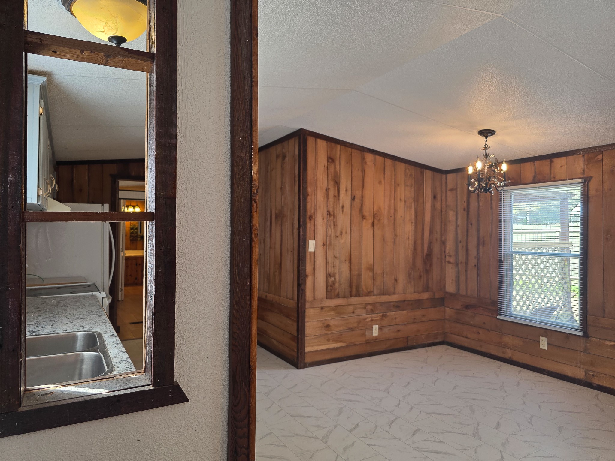 344 Holmes Road Onalaska, TX 77360 - Photo 9 of 25 309 Holmes view into the dining room from the living room