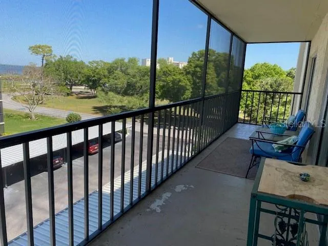 a view of a balcony with chairs