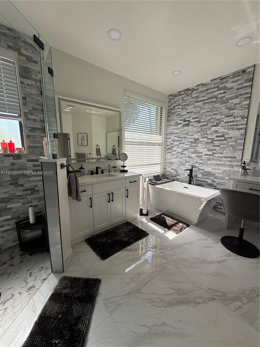 18610 Southwest 39th Court Miramar, FL 33029 - Photo 15 of 32 a kitchen with a sink stove and cabinets