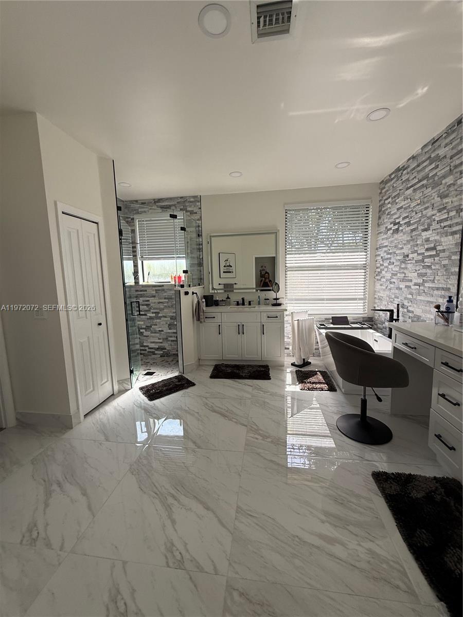 18610 Southwest 39th Court Miramar, FL 33029 - Photo 17 of 32 a view of a kitchen with dining table and chairs